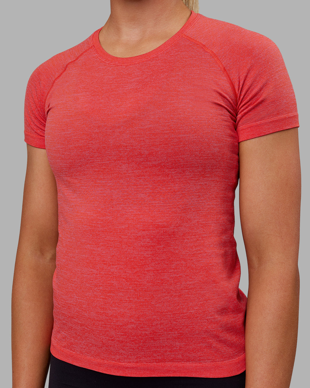 Woman wearing AeroFLX+ Seamless Tee - Fuchsia Pink/Grenadine - view 5