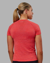 Woman wearing AeroFLX+ Seamless Tee - Fuchsia Pink/Grenadine | Thumbnail Index: 5