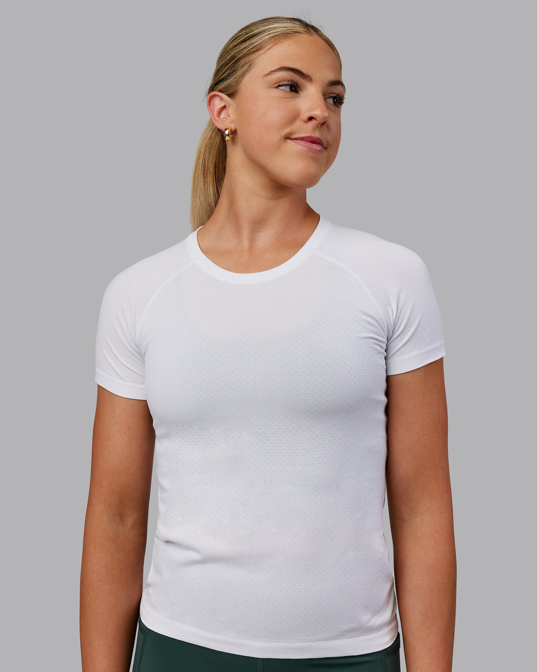 Woman wearing AeroFLX+ Seamless Tee - White/White - view 1