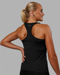 Woman wearing AeroFLX+ Seamless Tank - Black Marl | Thumbnail Index: 3