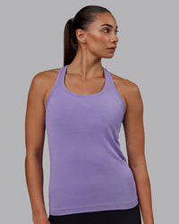 Woman wearing AeroFLX+ Seamless Tank - Dahlia Purple Marl | Thumbnail Index: 1