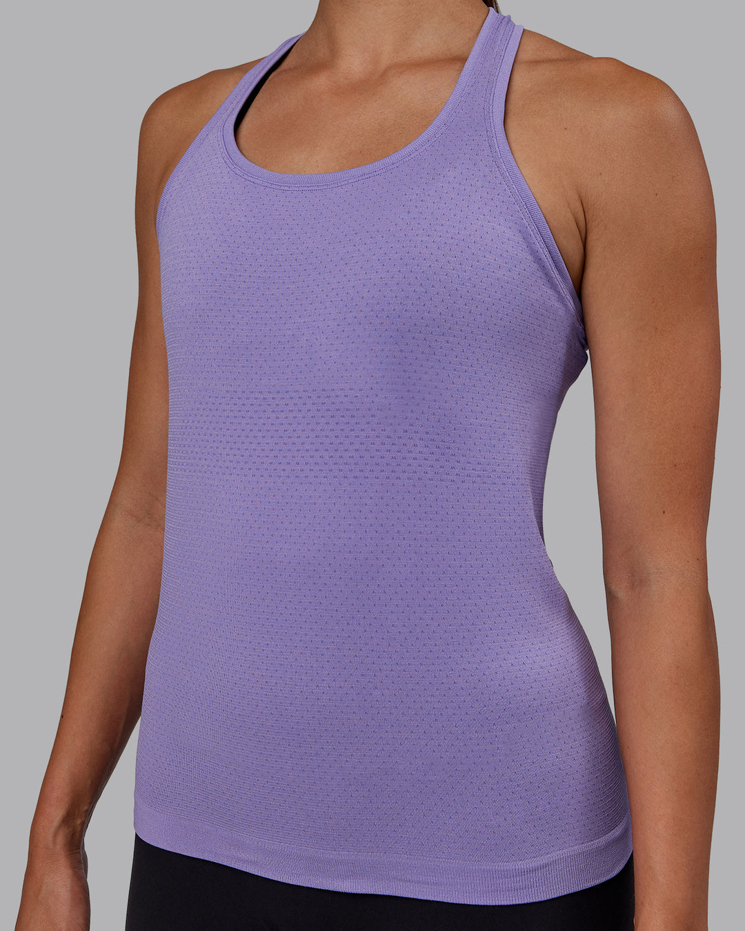 Woman wearing AeroFLX+ Seamless Tank - Dahlia Purple Marl - view 8