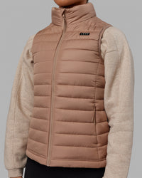 Woman wearing All Day Puffer Vest - Desert | Thumbnail Index: 1