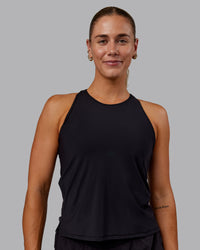 Woman wearing Cadence Tank - Black | Thumbnail Index: 1