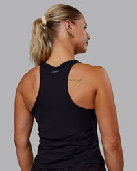 Woman wearing Cadence Tank - Black | Thumbnail Index: 3