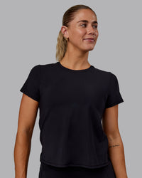 Woman wearing Cadence Tee - Black | Thumbnail Index: 0