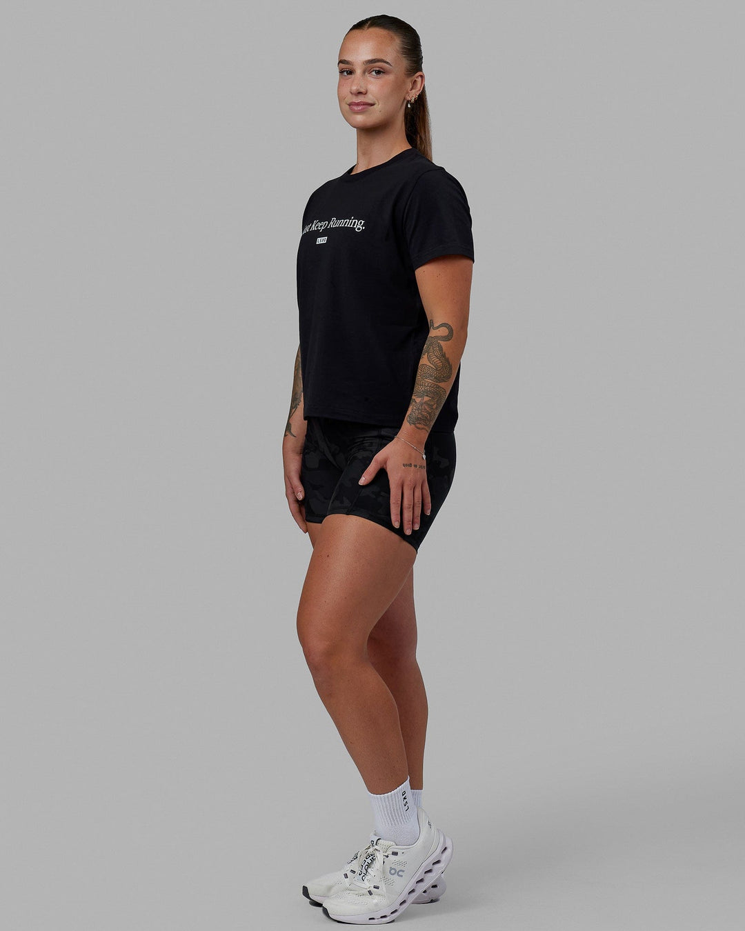 Woman wearing Just Keep Running FLXCotton Tee - Black-White - view 2