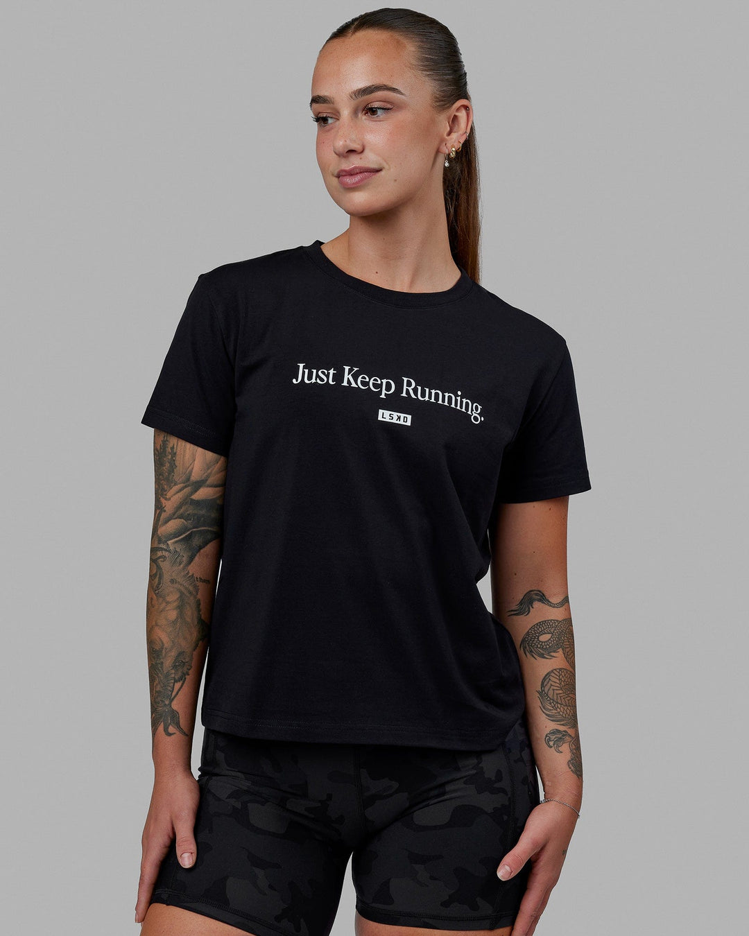 Woman wearing Just Keep Running FLXCotton Tee - Black-White - view 1