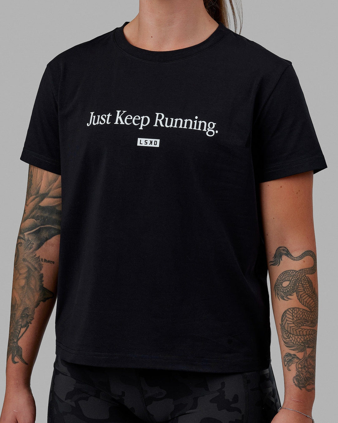 Woman wearing Just Keep Running FLXCotton Tee - Black-White - view 6