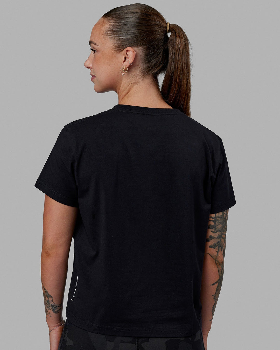 Woman wearing Just Keep Running FLXCotton Tee - Black-White - view 4