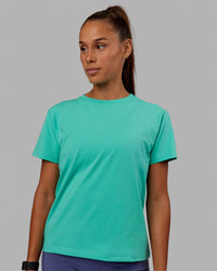 Woman wearing Love The Run FLXCotton Tee - Aquatic Awe-White | Thumbnail Index: 3