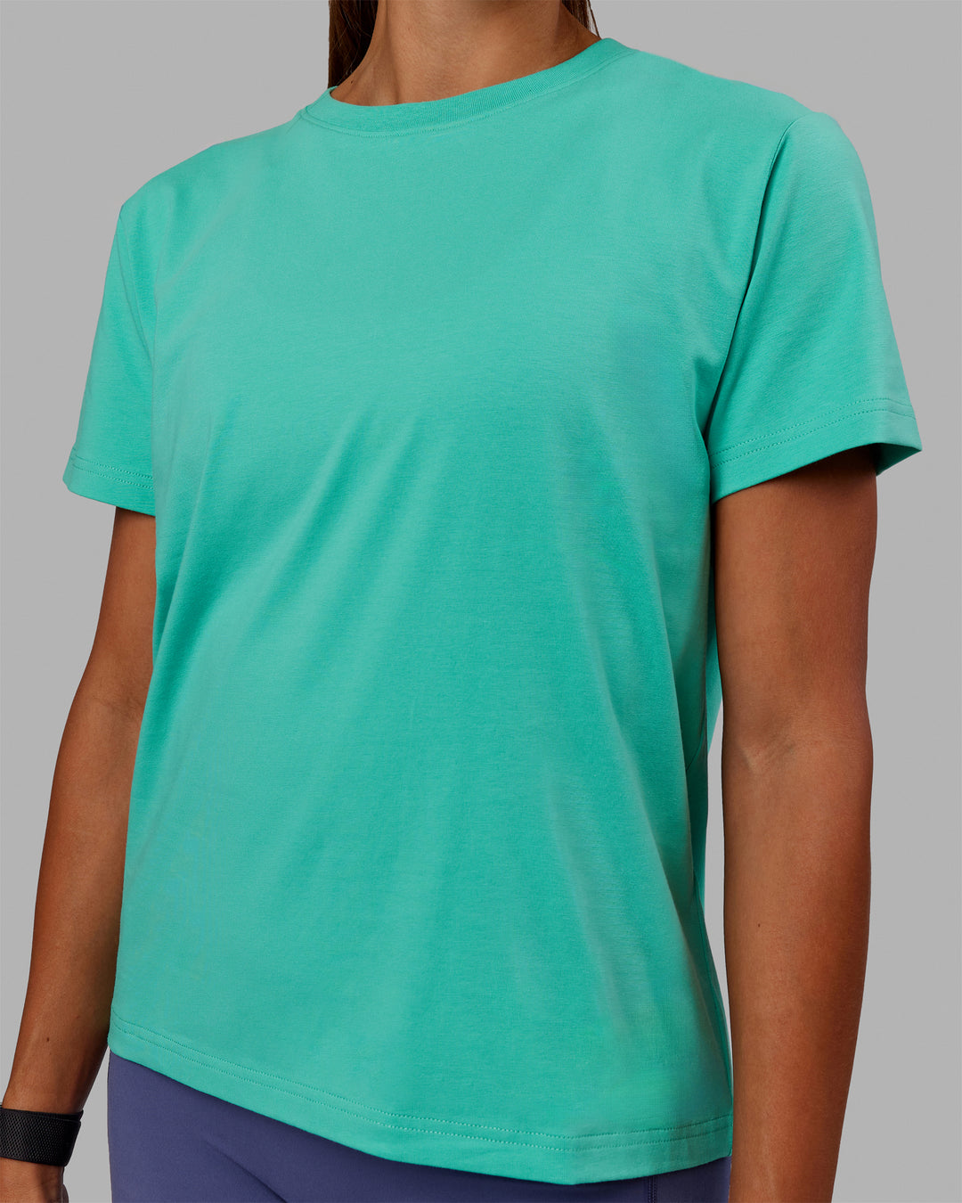 Woman wearing Love The Run FLXCotton Tee - Aquatic Awe-White - view 6