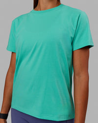 Woman wearing Love The Run FLXCotton Tee - Aquatic Awe-White | Thumbnail Index: 5