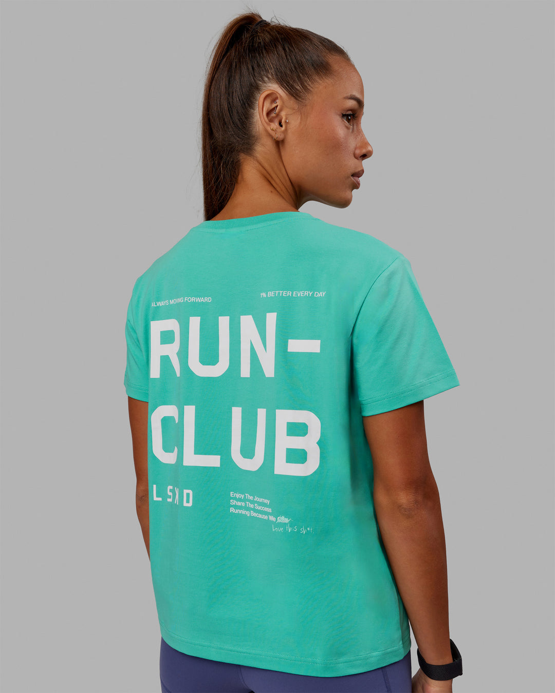 Woman wearing Love The Run FLXCotton Tee - Aquatic Awe-White - view 1