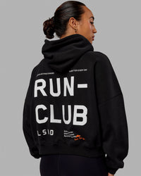 Woman wearing Love The Run Hoodie - Black | Thumbnail Index: 0