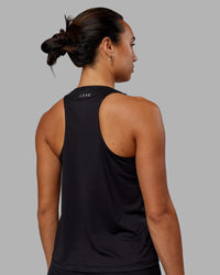 Woman wearing Pace Running Tank - Black | Thumbnail Index: 2