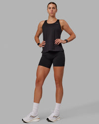 Woman wearing Perform VapourFLX Tank - Black | Thumbnail Index: 0