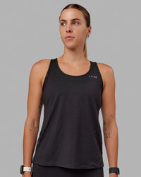 Woman wearing Perform VapourFLX Tank - Black | Thumbnail Index: 4