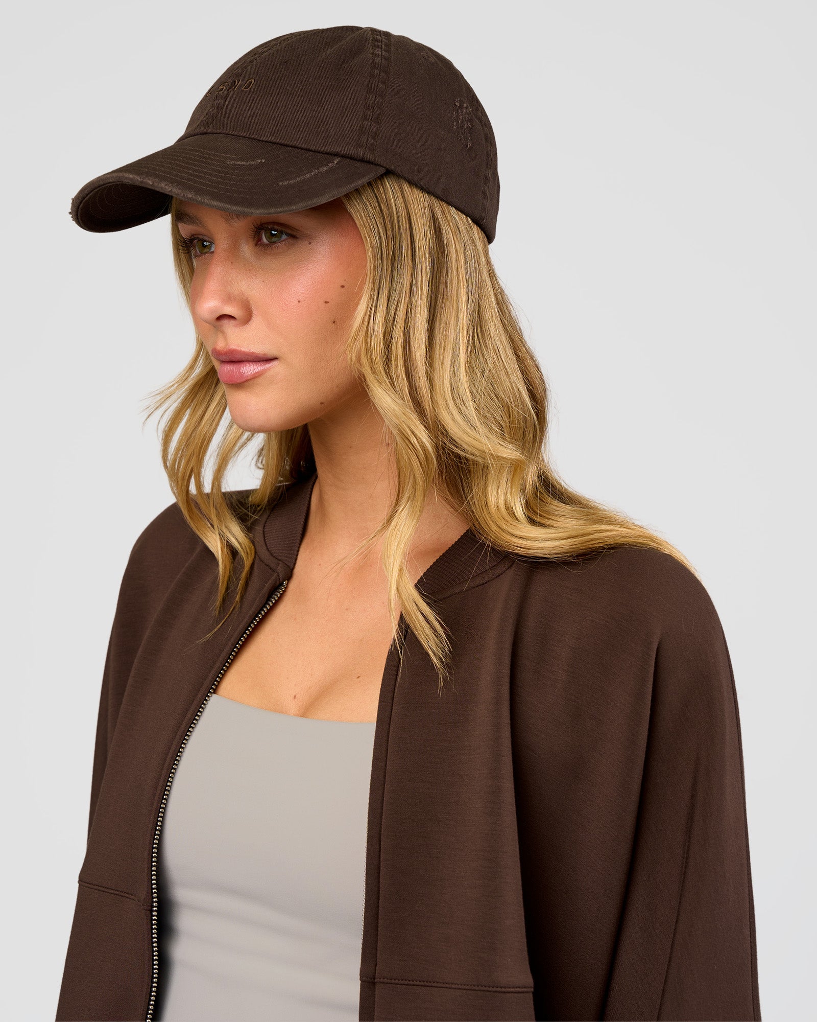 Woman wearing CF Move Through Cap - Hot Chocolate | Model:Leilani | Size:OS
