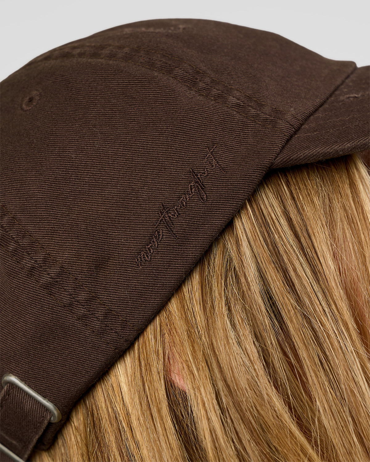 Woman wearing CF Move Through Cap - Hot Chocolate | Model:Leilani | Size:OS