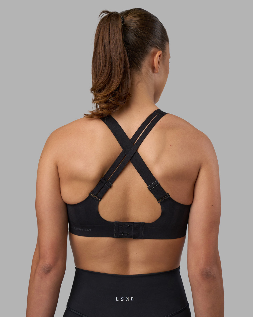 Woman wearing Stability Sports Bra - Black | Model:Charlize | Size:S (A-C Cup) - view 4