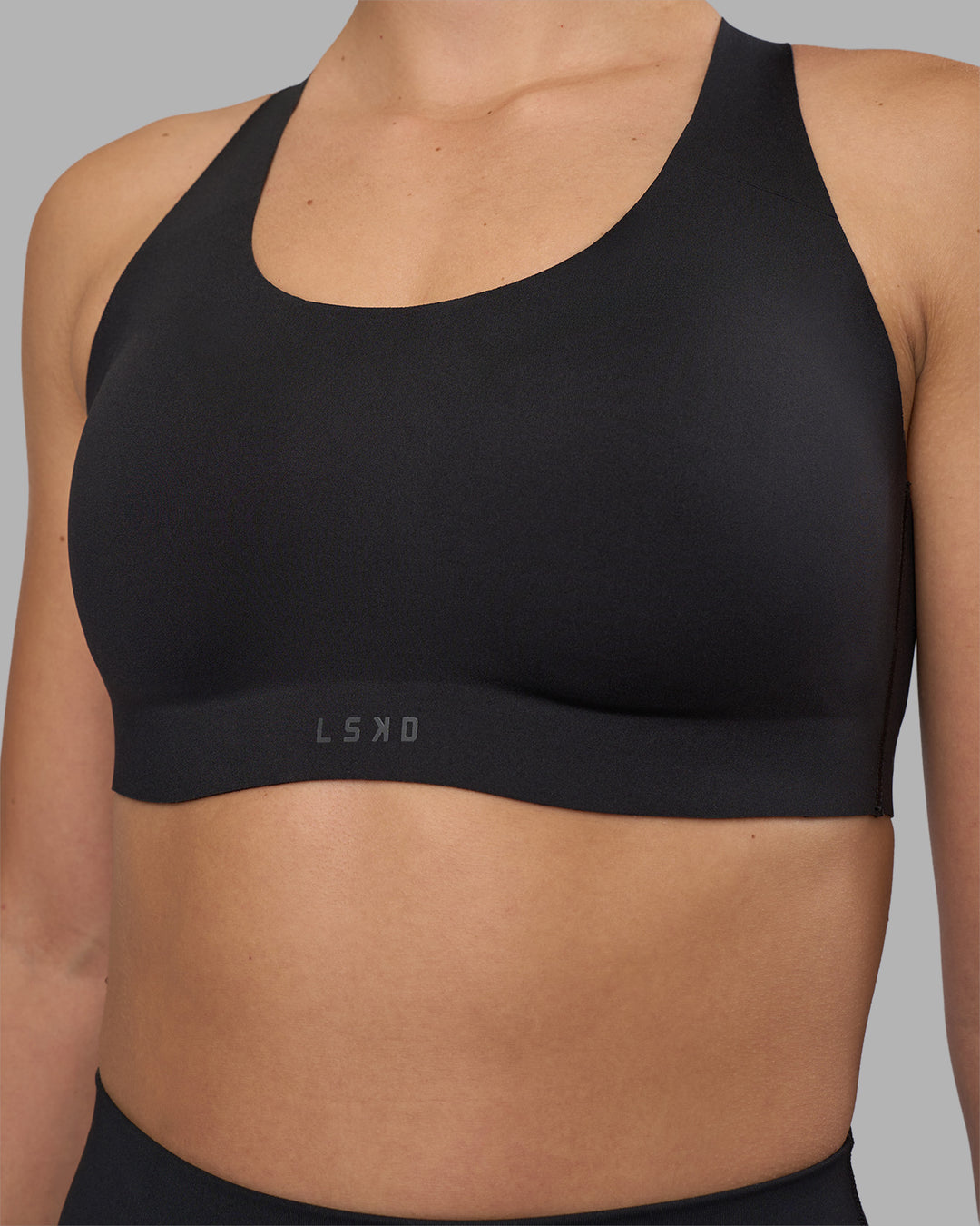 Woman wearing Stability Sports Bra - Black | Model:Charlize | Size:S (A-C Cup) - view 8