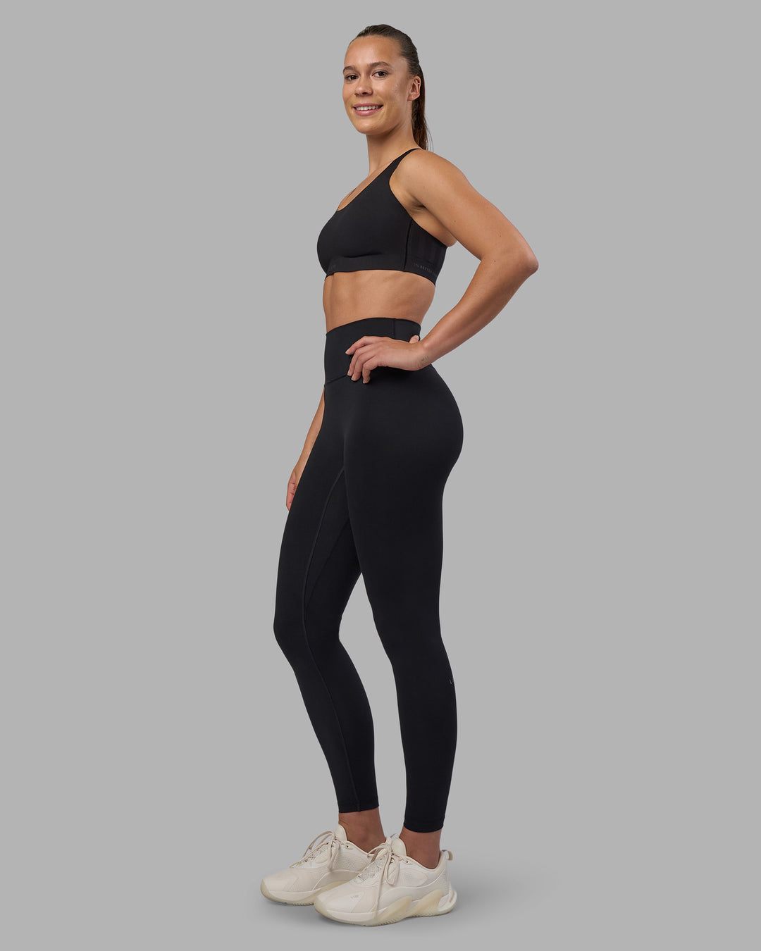 Woman wearing Stability Sports Bra - Black | Model:Charlize | Size:S (A-C Cup) - view 10