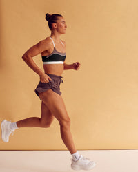 Woman wearing Accelerate 3" High-Rise Running Short - Cocoa Powder | Model:Charlize | Size:S | Thumbnail Index: 2
