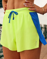 Woman wearing Accelerate 3" High-Rise Running Short - Electric Indigo-Lime Glo | Model:Jasynta | Size:S | Thumbnail Index: 3