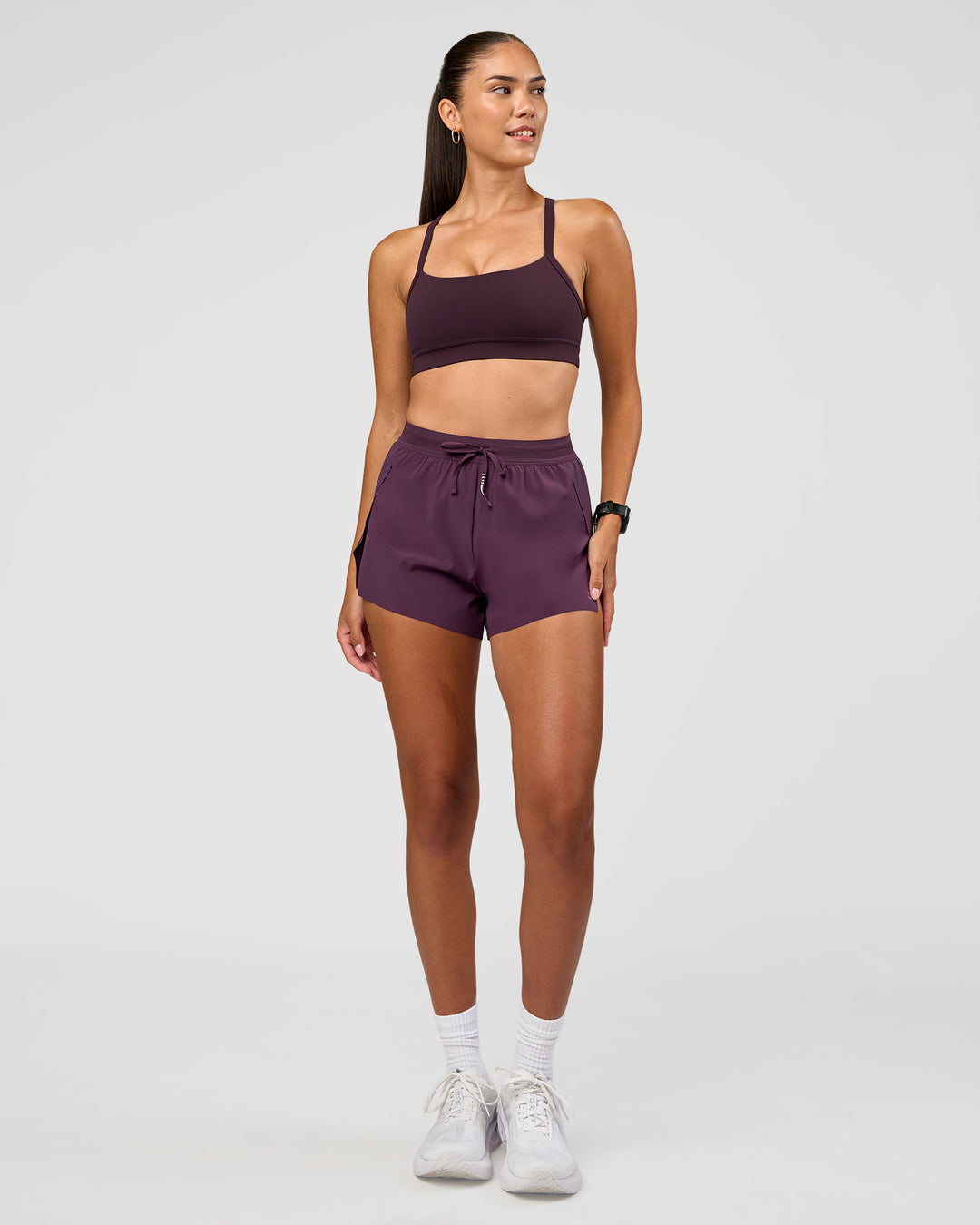 Woman wearing Accelerate 3" High-Rise Running Short - Midnight Plum | Model:Rhiley | Size:S - view 3