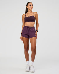 Woman wearing Accelerate 3" High-Rise Running Short - Midnight Plum | Model:Rhiley | Size:S | Thumbnail Index: 2