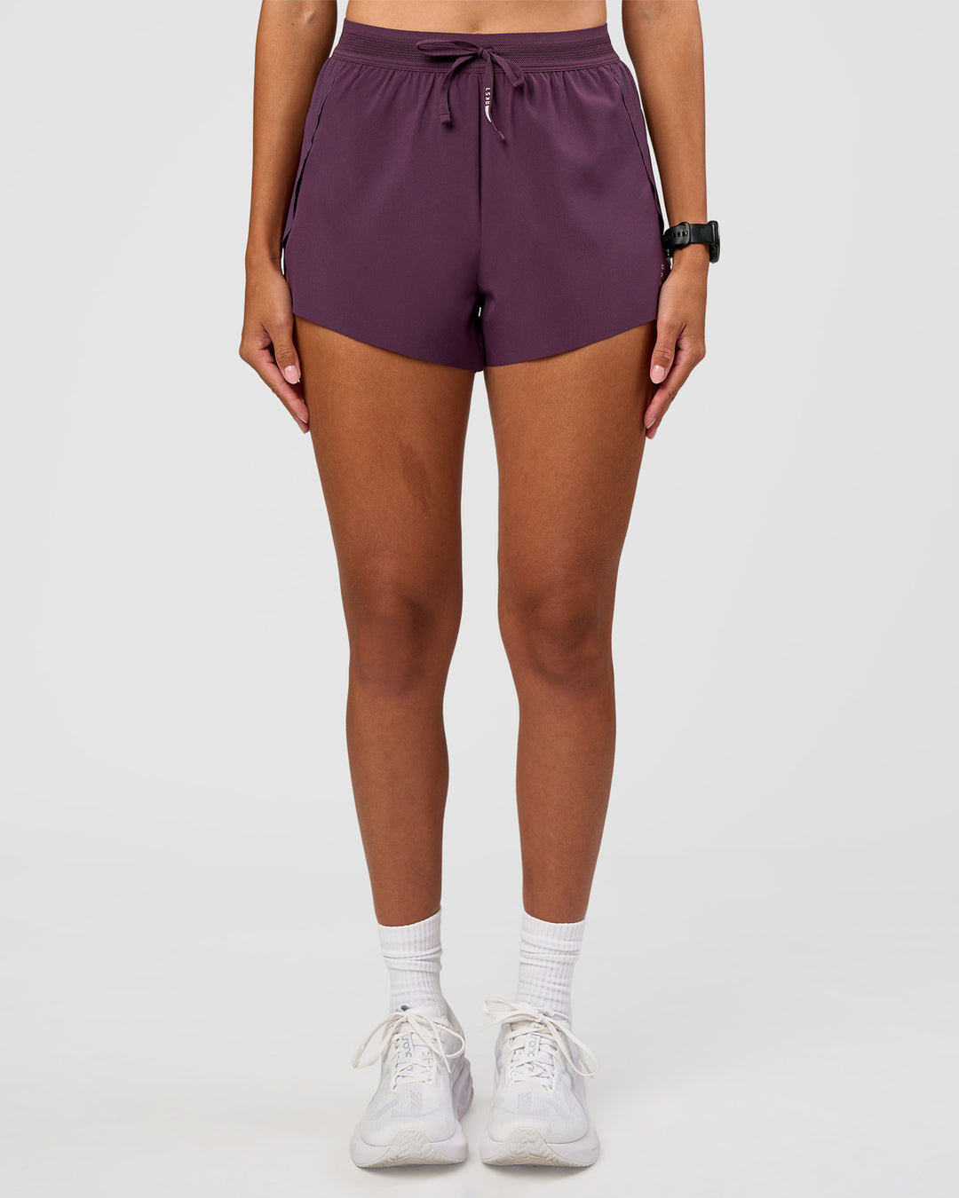 Woman wearing Accelerate 3" High-Rise Running Short - Midnight Plum | Set:true | Angle:front | Model:Rhiley | Size:S - view 1