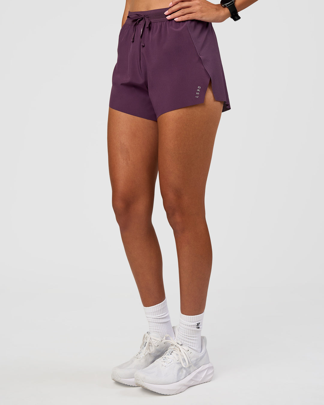 Woman wearing Accelerate 3" High-Rise Running Short - Midnight Plum | Set:true | Angle:side | Model:Rhiley | Size:S - view 7