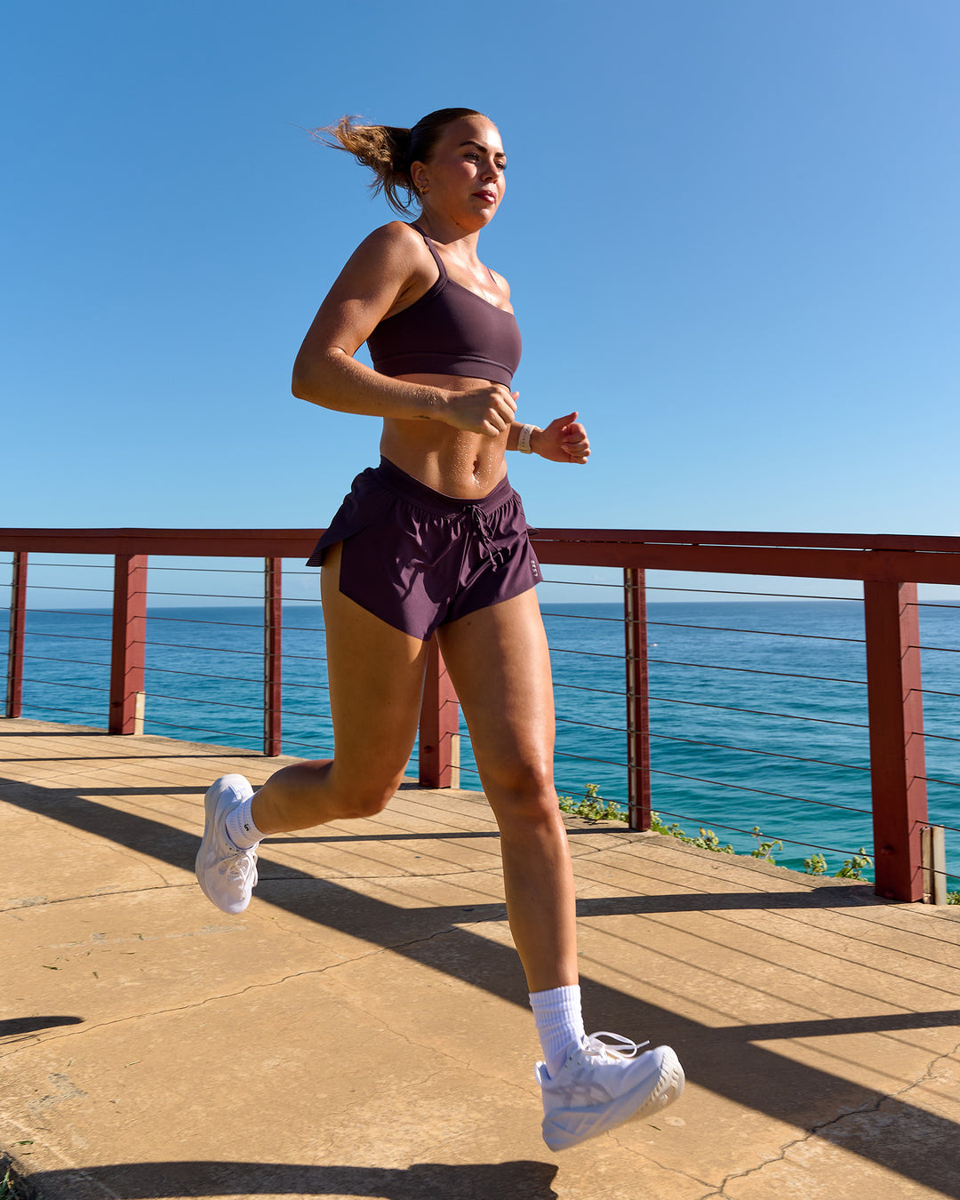 Woman wearing Accelerate 3" Mid-Rise Running Short - Midnight Plum | Model:Roisin | Size:S - view 4