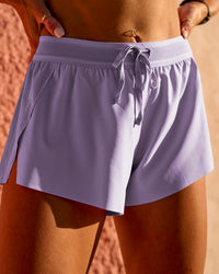 Woman wearing Accelerate 3" Mid-Rise Running Short - Pale Lilac | Model:Lauren | Size:S | Thumbnail Index: 4