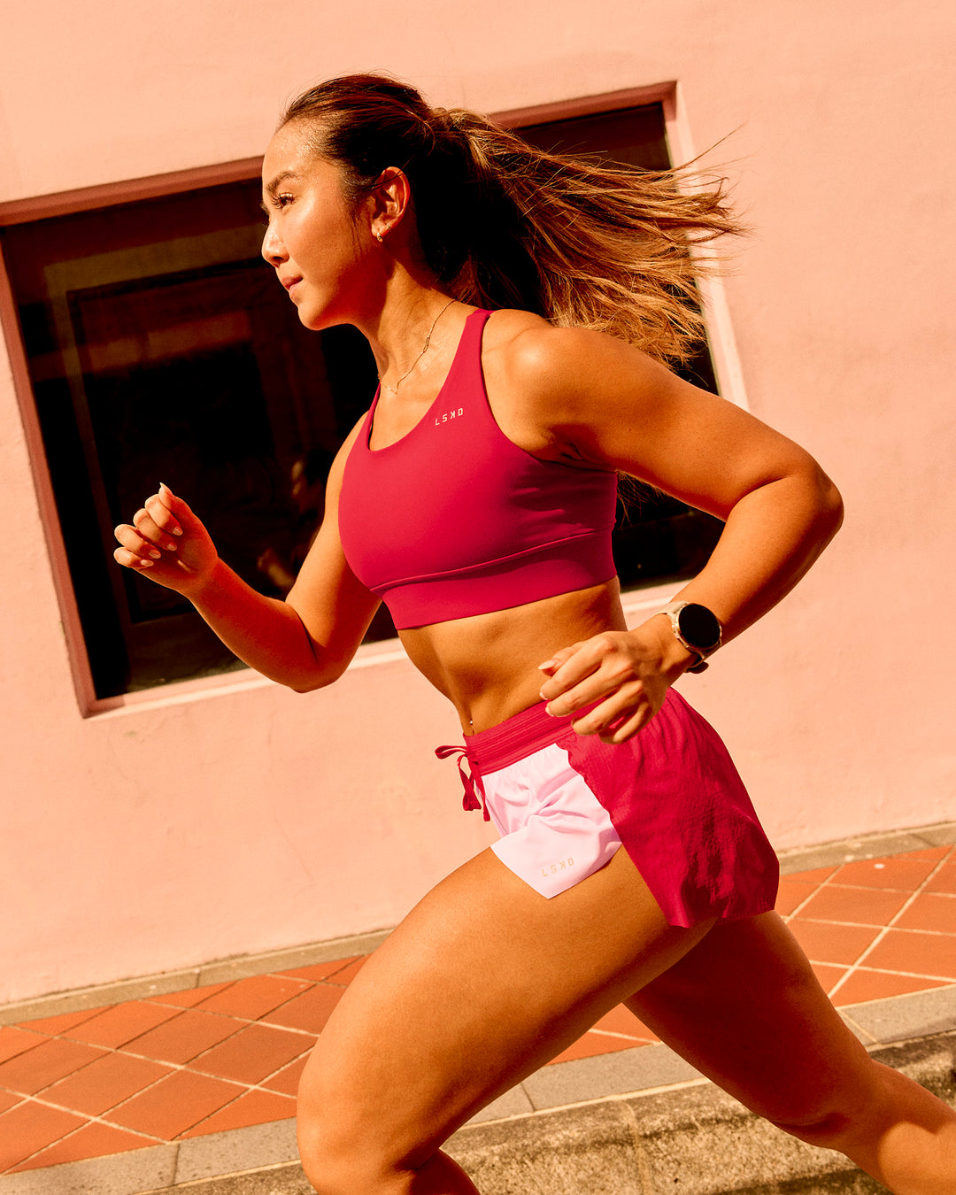 Woman wearing Accelerate 3" Mid-Rise Running Short - Scarlet-Marshmallow | Model:Clare | Size:S - view 2