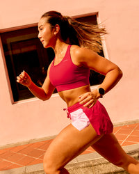 Woman wearing Accelerate 3" Mid-Rise Running Short - Scarlet-Marshmallow | Model:Clare | Size:S | Thumbnail Index: 1