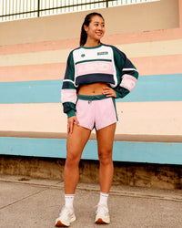 Woman wearing Accelerate 3" Mid-Rise Running Short - Transformative Teal-Marshmallow | Model:Vanessa | Size:S | Thumbnail Index: 3