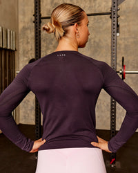 Woman wearing AeroFLX+ Seamless Long Sleeve Tee - Midnight Plum/Midnight Plum | Model:Charli | Size:XS | Thumbnail Index: 5