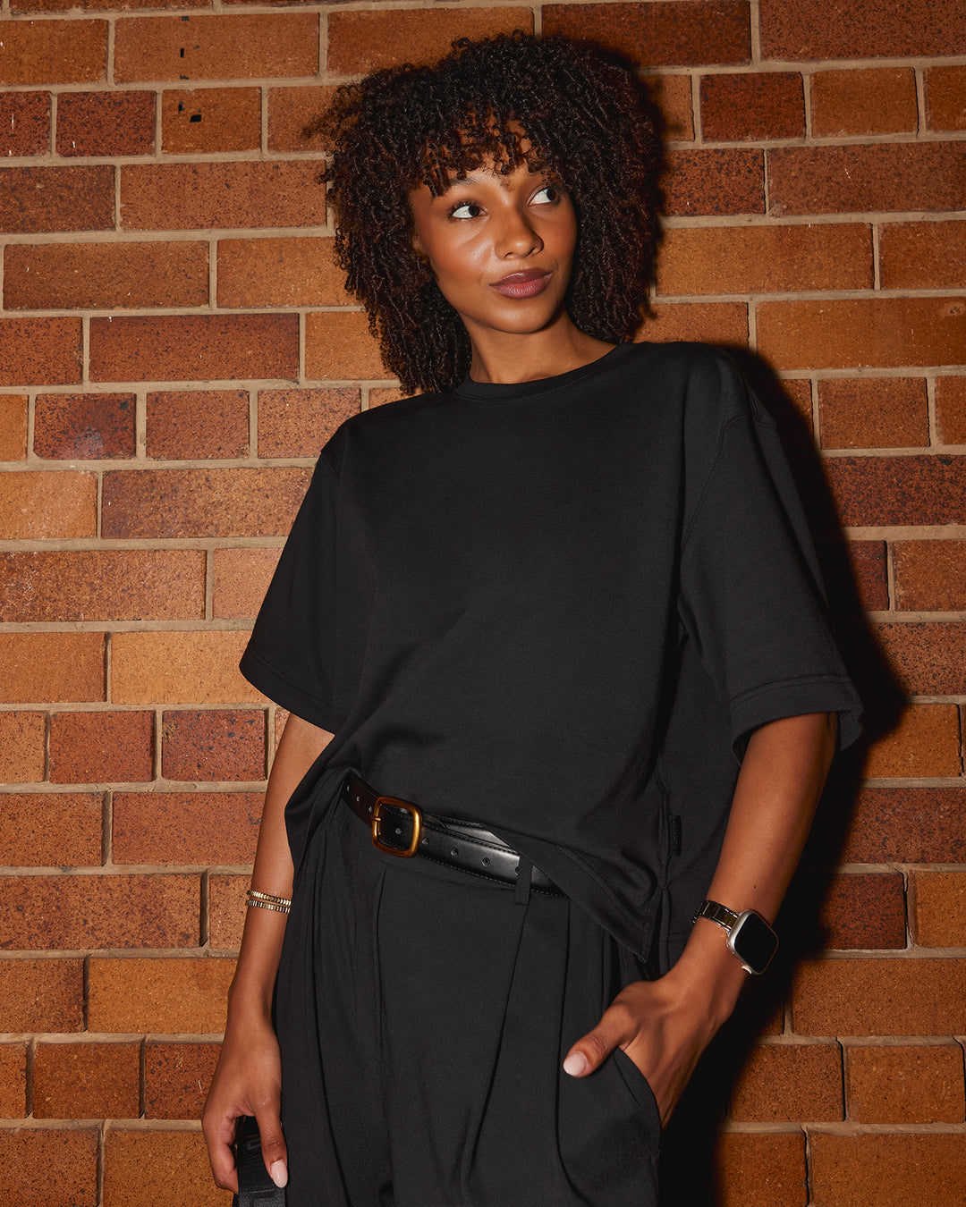 Woman wearing AfterDark ZeroCrease Cropped Tee - Black | Model:Tomi | Size:S - view 4