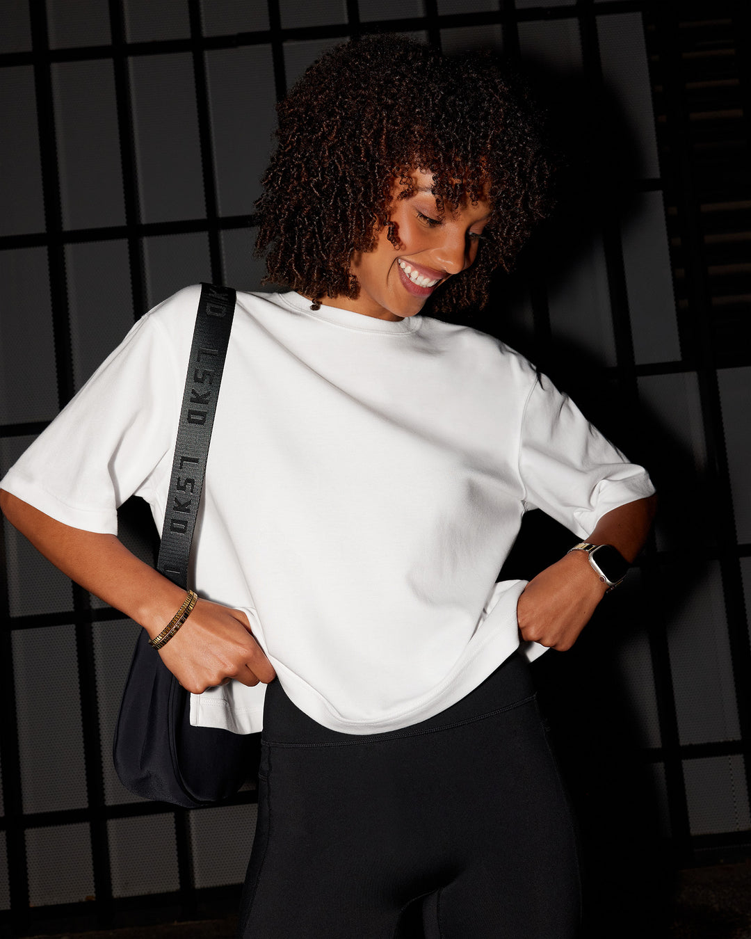 Woman wearing AfterDark ZeroCrease Cropped Tee - White | Model:Tomi | Size:S - view 2