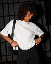 Woman wearing AfterDark ZeroCrease Cropped Tee - White | Model:Tomi | Size:S | Thumbnail Index: 1