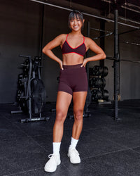 Woman wearing Ambience Sports Bra - Cherry Lacquer-Flame | Model:Iris | Size:S | Thumbnail Index: 2