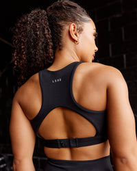 Woman wearing Ascent Sports Bra - Black | Model:Tarnie | Size:S | Thumbnail Index: 1