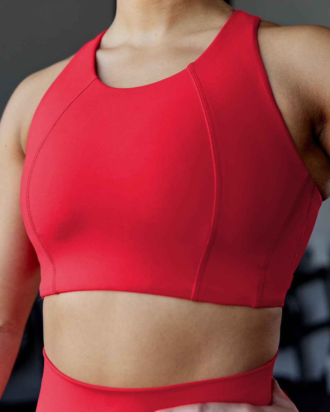 Woman wearing Ascent Sports Bra - Scarlet | Model:Ayla | Size:S - view 1