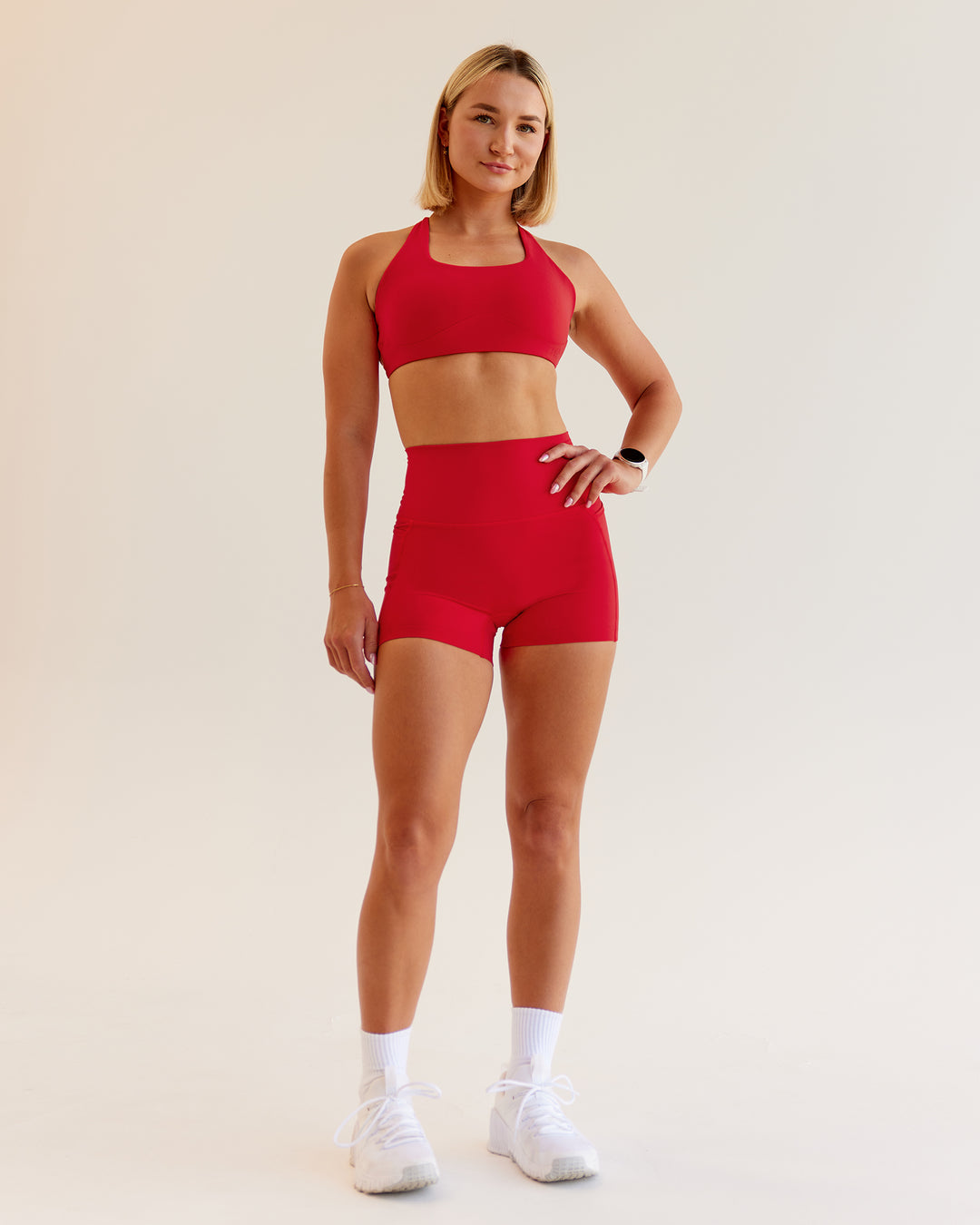 Woman wearing Aspire Sports Bra in Flame | Size:S - view 4