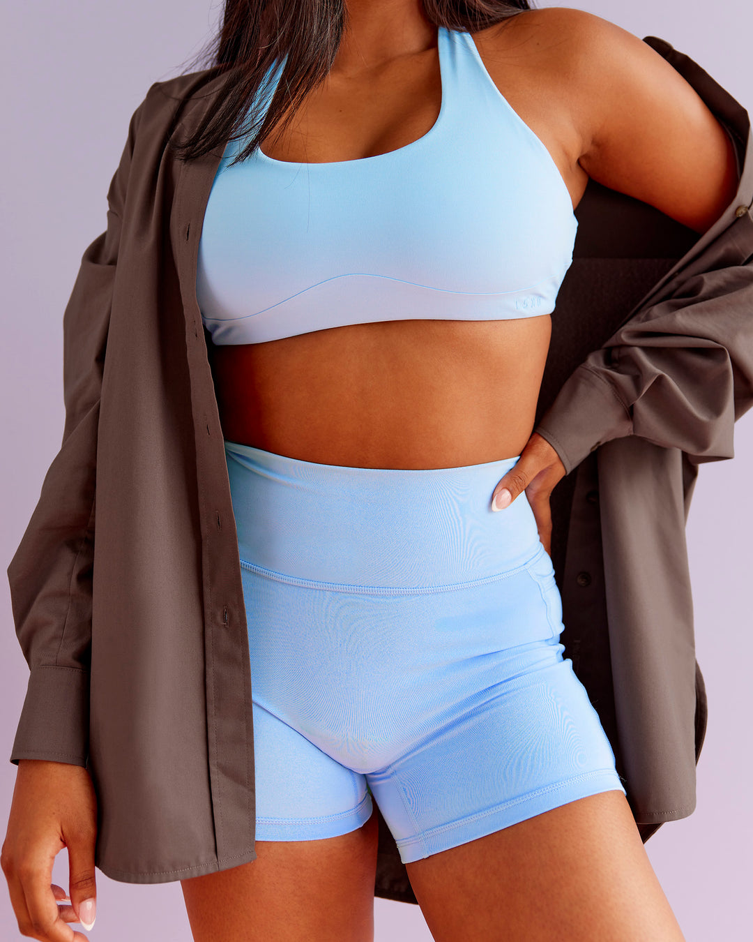 Woman wearing Aspire Sports Bra - Open Air | Model:Nikki | Size:S - view 1