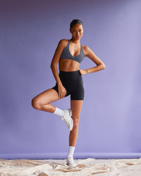 Woman wearing Aspire Twist Sports Bra - Night Shadow | Model:Tali | Size:S | Thumbnail Index: 3