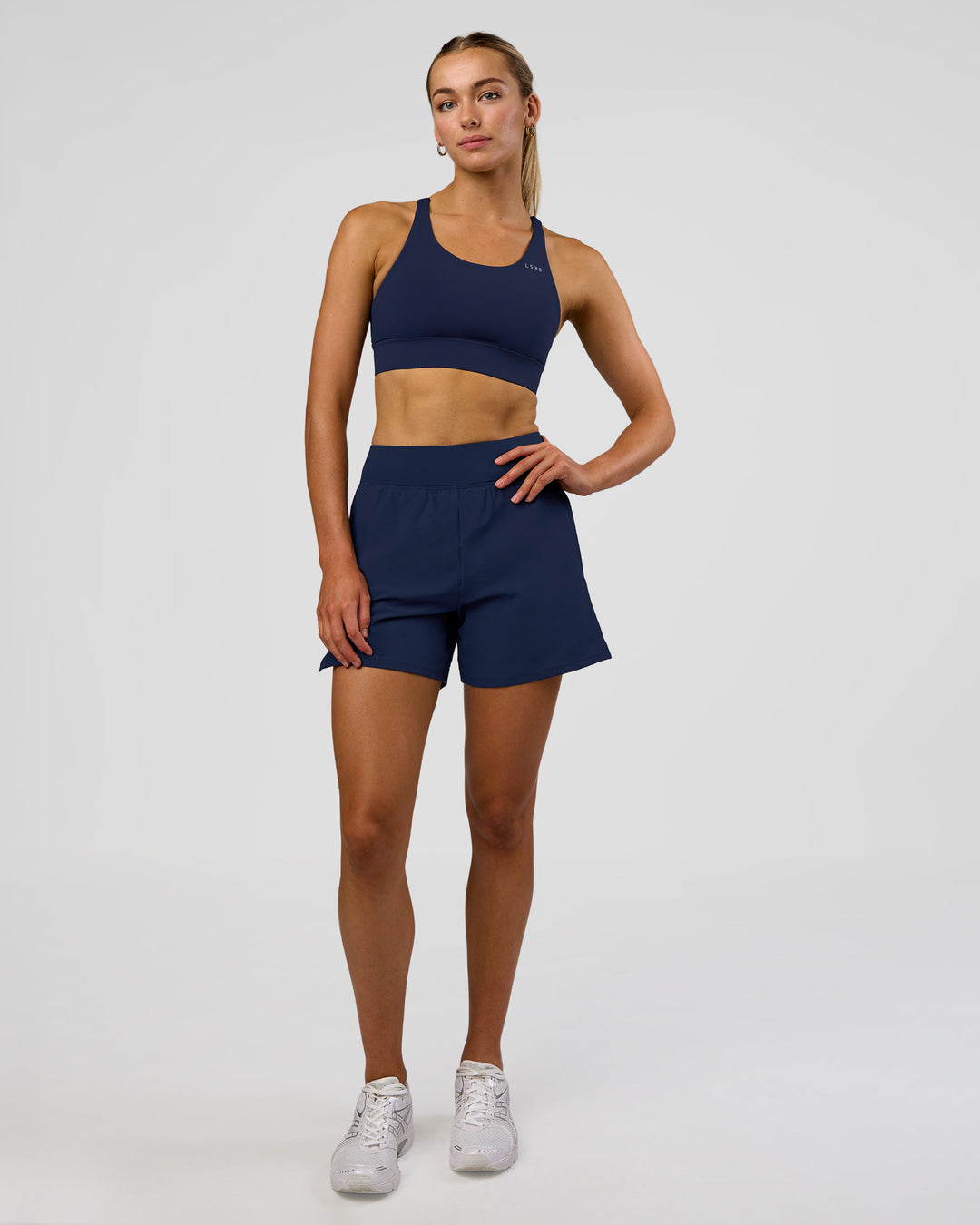 Woman wearing Challenger 5" Lined Performance Short - Future Navy | Model: Evie | Size:S - view 1