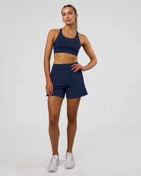 Woman wearing Challenger 5" Lined Performance Short - Future Navy | Model: Evie | Size:S | Thumbnail Index: 0
